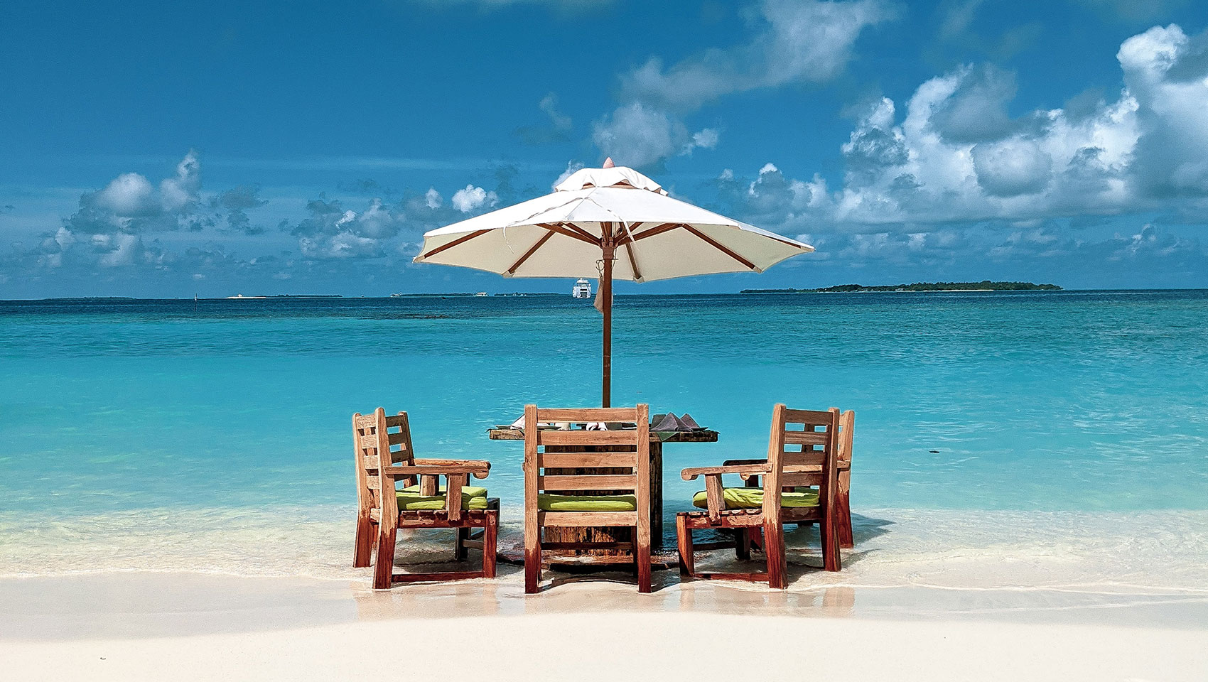 tables and chair on beach