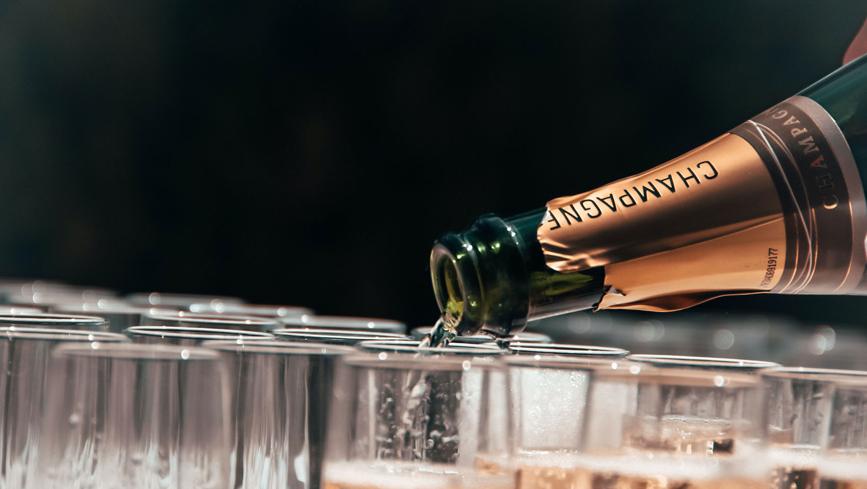 champagne being poured into glasses